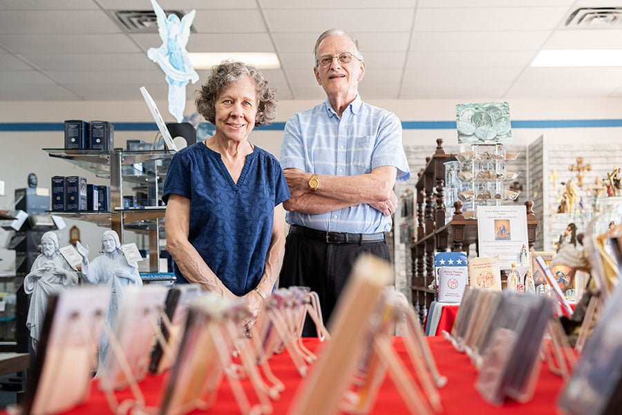Mary Myers and John Horan stand in bookstore
